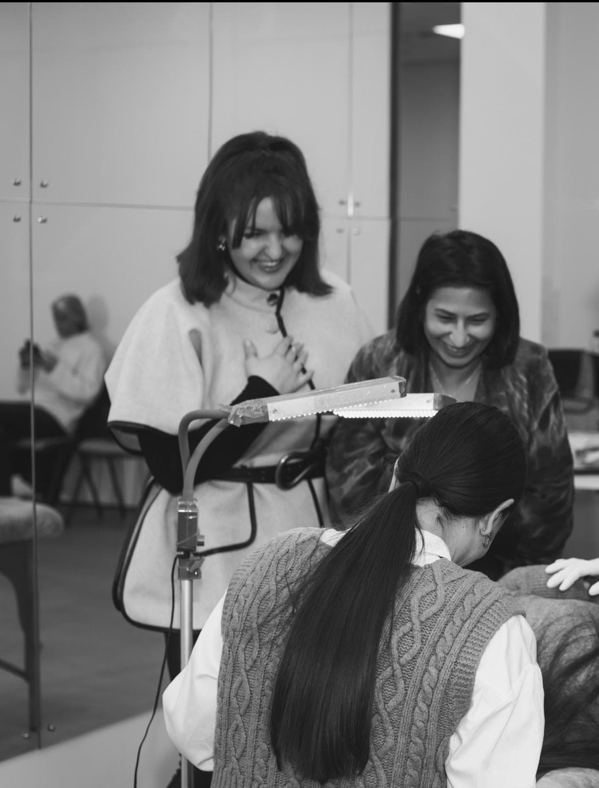 Students laughing together during a hands-on training session